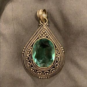 Antique silver pendant with green stone